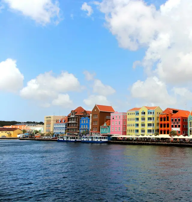 The colourful Handelskade waterfront of Willemstad, Curaçao, seen from the Queen Emma Bridge