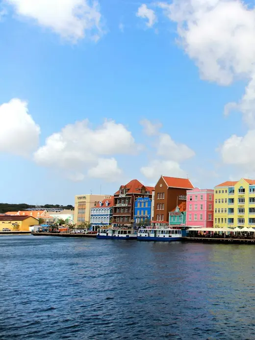 Colourful colonial buildings along the Handelskade waterfront in Willemstad, Curaçao