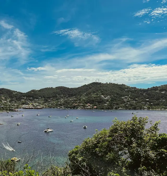 Yachts at anchor in the bay at Port Elizabeth, Bequia, St. Vincent and the Grenadines, beneath green hills